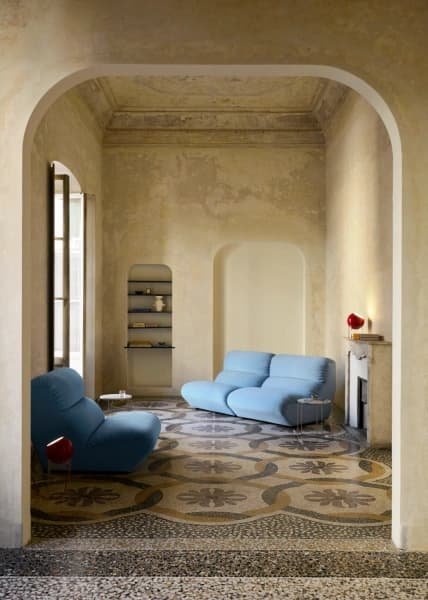 Room with a red accent wall and a wall lamp