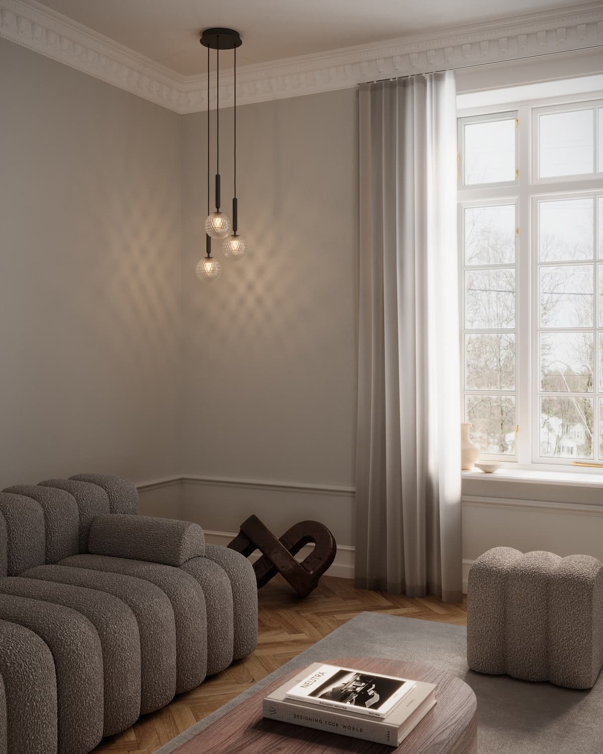 Living room with a brown sofa and sculptural pendant lights