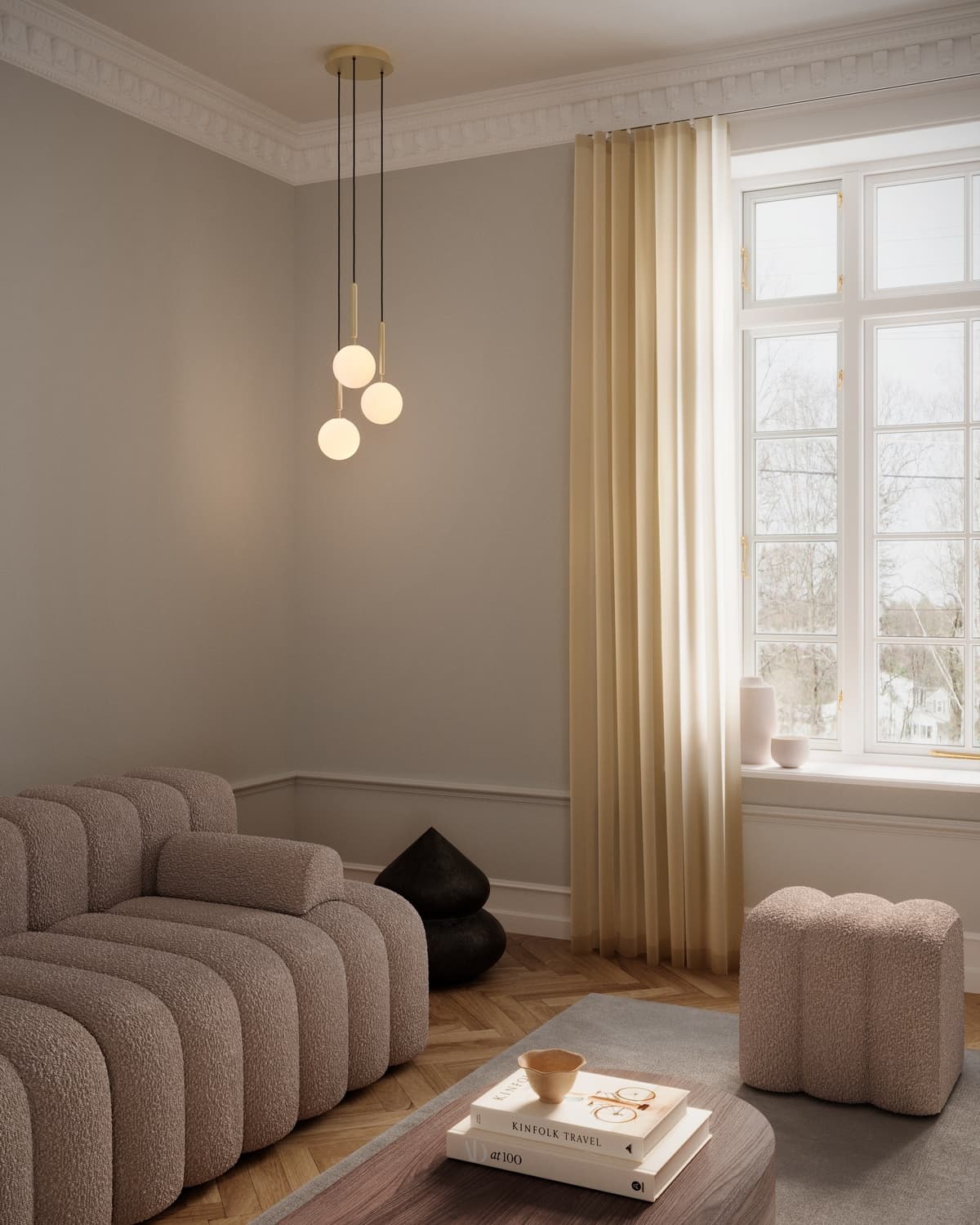 Living room with a brown sofa and sculptural pendant lights
